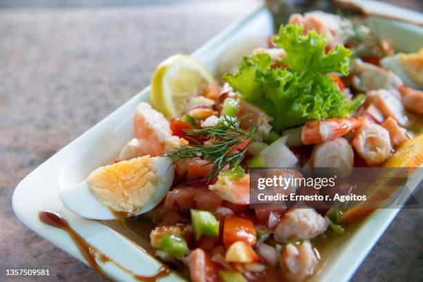 salpicón (seafood salad with tiny sliced onion, peppers and tomatoes, oil and vinegar) - seafood salad stock pictures, royalty-free photos & images