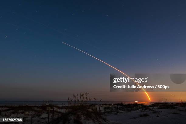 scenic view of landscape against sky at night,st augustine,florida,united states,usa - vapour trail stock pictures, royalty-free photos & images