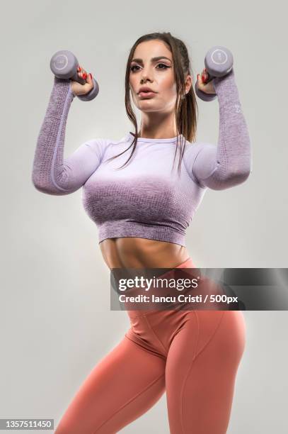 athletic young woman doing a fitness workout - mental toughness stock pictures, royalty-free photos & images