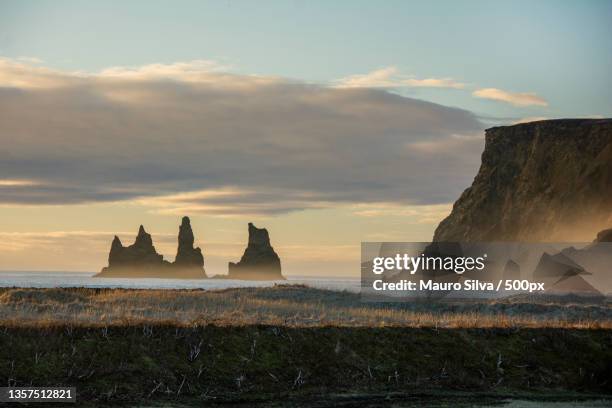 black sand beach,scenic view of sea against sky during sunset - islândia stock pictures, royalty-free photos & images