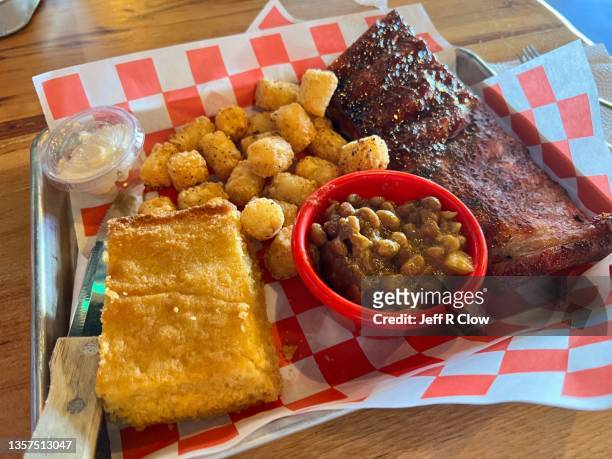 half rack rib meal with beans and cornbread - southern food stock pictures, royalty-free photos & images