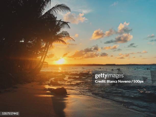 dusk,scenic view of sea against sky during sunset,siargao island,philippines - noveno stock-fotos und bilder