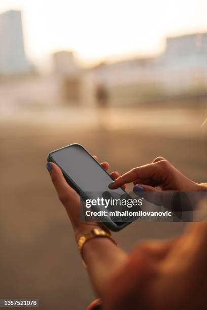 checking her phone - finger dialing touch tone telephone stock pictures, royalty-free photos & images