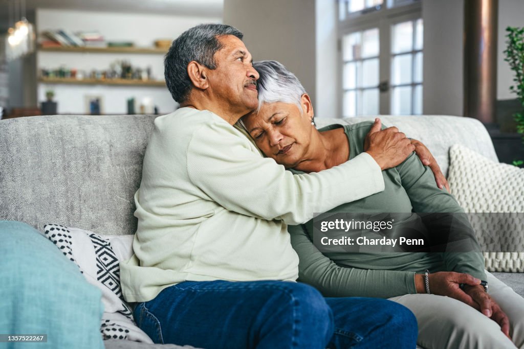 Shot of a senior man supporting his wife during a difficult time at home