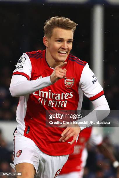 Martin Odegaard of Arsenal celebrates scoring the opening goal during the Premier League match between Everton and Arsenal at Goodison Park on...