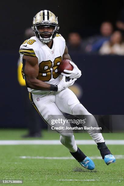 Ty Montgomery of the New Orleans Saints runs with the ball against the Dallas Cowboys during a game at the the Caesars Superdome on December 02, 2021...