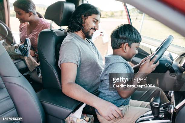 road adventure - family with kids using the car - indian ethnicity car stock pictures, royalty-free photos & images