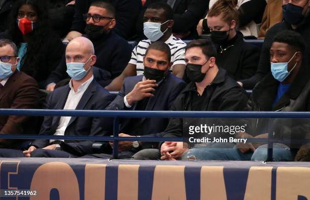 Former handball players Thierry Omeyer, Daniel Narcisse, rugby player of Racing 92 Camille Chat attend the EHF Champions League between Paris...