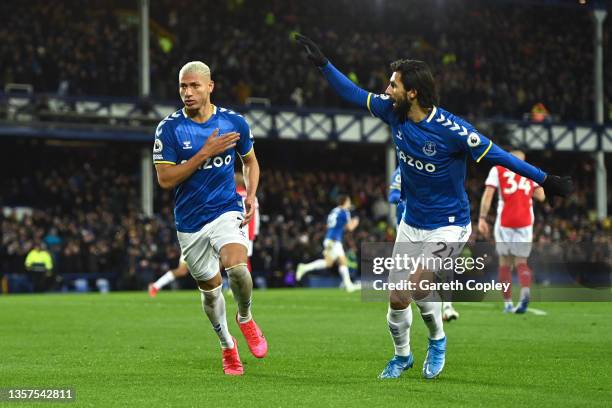 Richarlison of Everton celebrates with teammate Andre Gomes after scoring their side's first goal during the Premier League match between Everton and...