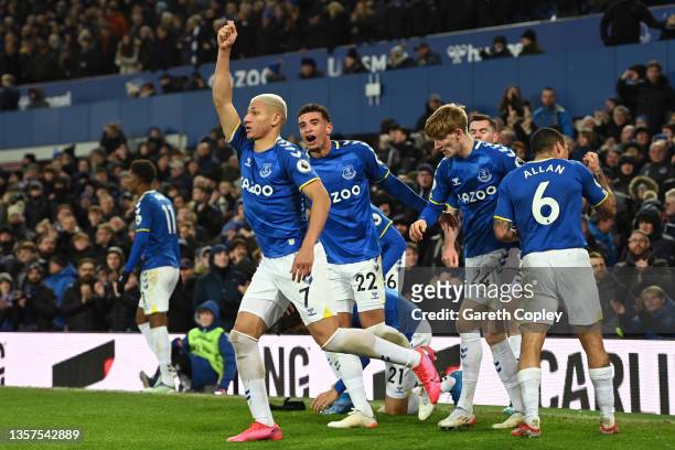 Richarlison of Everton celebrates after scoring their side's first goal during the Premier League match between Everton and Arsenal at Goodison Park...