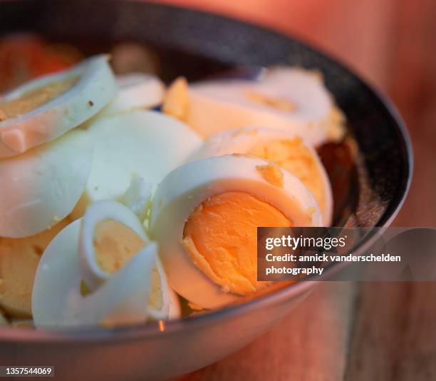 hard-boiled eggs into slices - hard boiled eggs fotografías e imágenes de stock