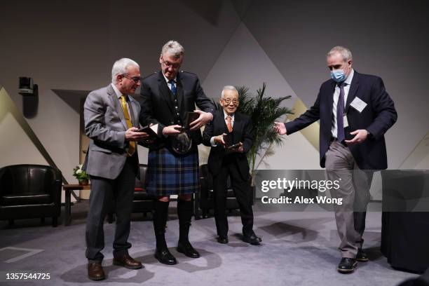 Bill Kearney of National Academy of Sciences guides economic sciences laureate Joshua Angrist, chemistry laureate David MacMillan and physics...