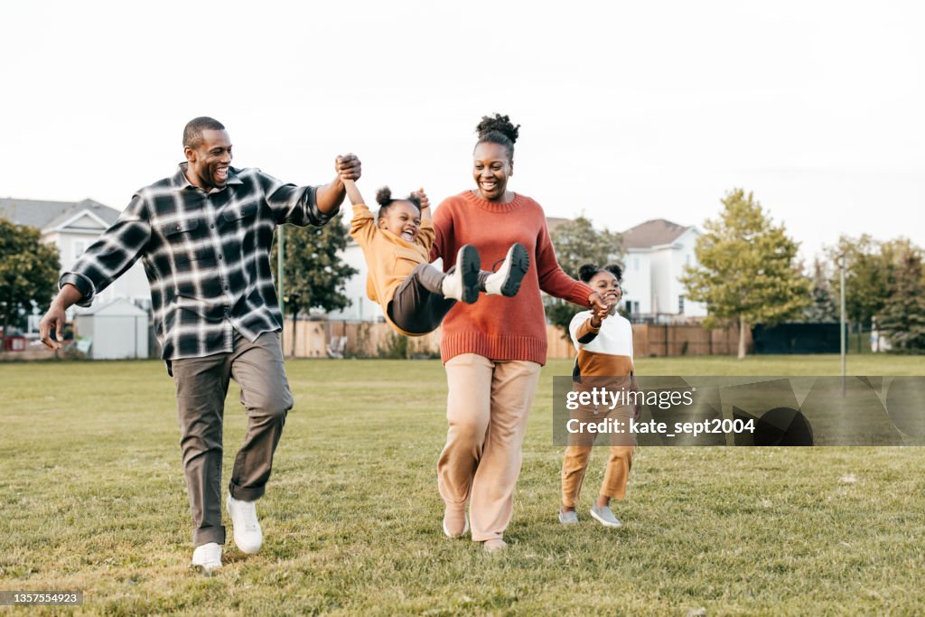 Family enjoying springtime outdoors with kids