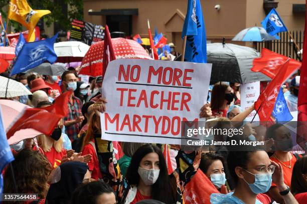 Thousands of teachers listen to speeches outside NSW Parliament House in the CBD on December 07, 2021 in Sydney, Australia. Thousands of teachers...