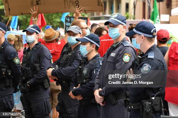 Police officers patrol during a protest march by thousands of teachers as they march on Macquarie Street to NSW Parliament House in the CBD on...