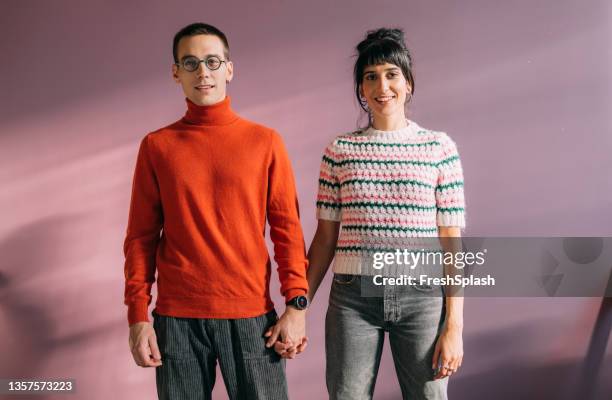 a beautiful young couple looking at camera - turtleneck stock pictures, royalty-free photos & images
