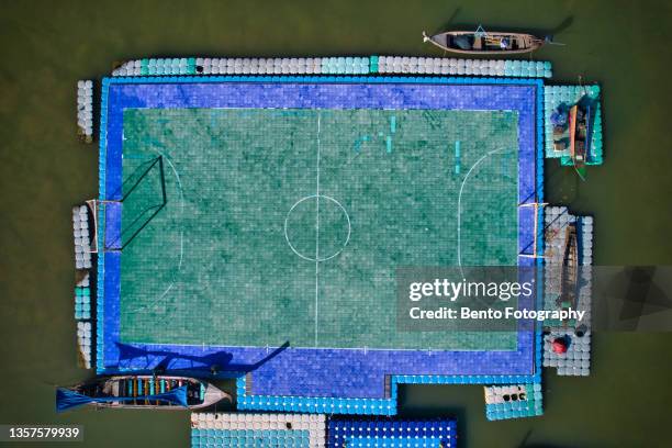 the most beautiful floating football field in the world at panyi island or koh panyee, thailand. - aerial football photos et images de collection