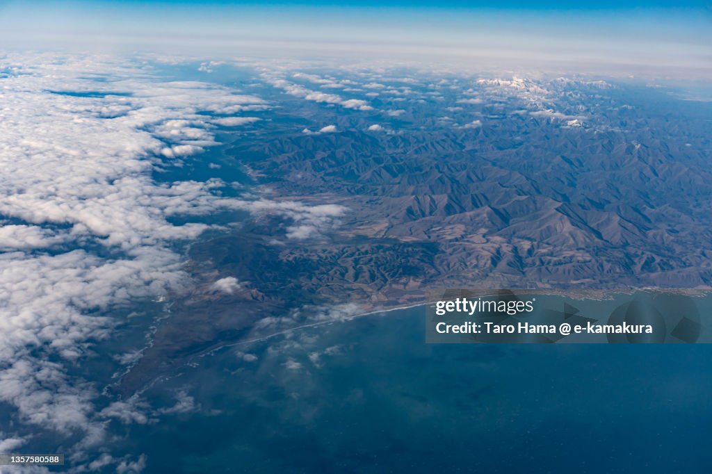 Snowcapped Hidaka Mountains in Hokkaido of Japan aerial view from airplane