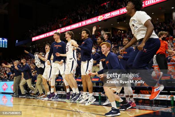 The Virginia Cavaliers bench reacts to the game-winning shot during a game against the Pittsburgh Panthers at John Paul Jones Arena on December 3,...