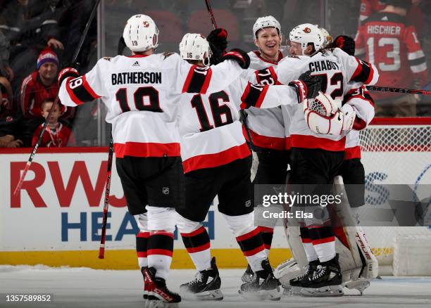 Brady Tkachuk and the rest of the Ottawa Senators celebrate the win over the New Jersey Devils at Prudential Center on December 06, 2021 in Newark,...