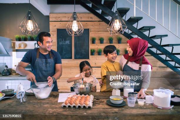 happy family in kitchen and fun - asian mother cooking imagens e fotografias de stock