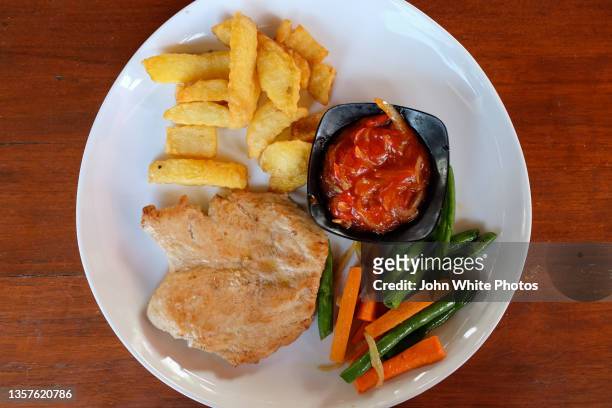 chicken, vegetables and fries. sanur. bali. indonesia. - sanur stock pictures, royalty-free photos & images