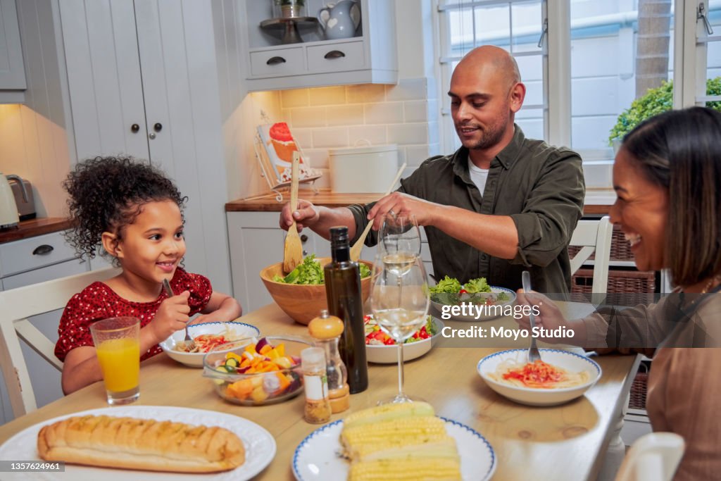 Shot of a family enjoying lunch together
