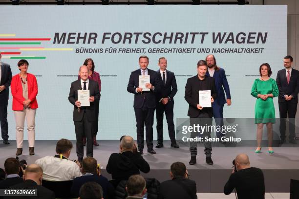 Olaf Scholz of the German Social Democrats , Robert Habeck , co-leader of the German Greens Party, and Christian Lindner , leader of the German Free...