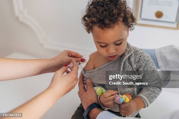 little boy getting vaccinated - two shot stock pictures, royalty-free photos & images