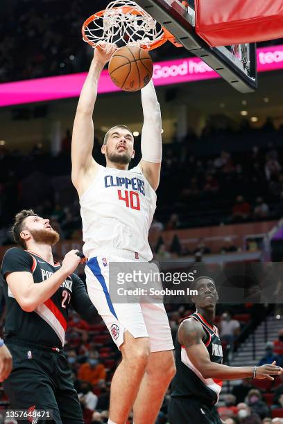 Ivica Zubac of the Los Angeles Clippers dunks the ball during the second half against the Portland Trail Blazers at Moda Center on December 06, 2021...