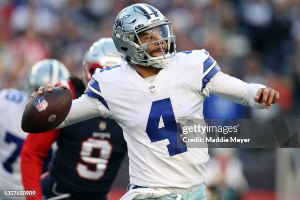 Dak Prescott of the Dallas Cowboys looks to pass against the New England Patriots at Gillette Stadium on October 17, 2021 in Foxborough,...