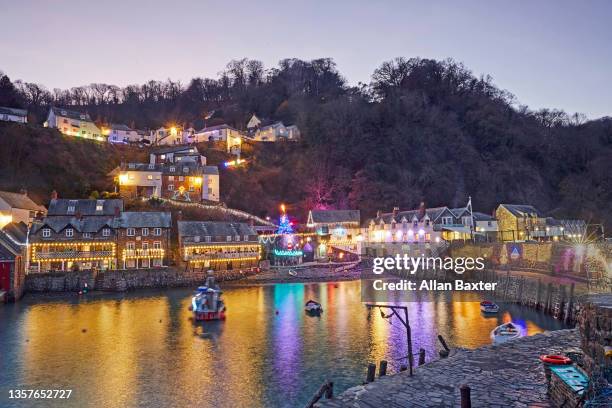 north devon seaside resort of clovelly illuminated at christmas - exeter devon stock pictures, royalty-free photos & images