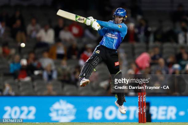 Harry Nielsen of the Adelaide Strikers jumps as he plays a shot during the Men's Big Bash League match between the Melbourne Renegades and the...