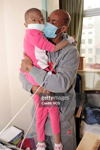 Basketball player Stephon Marbury of Beijing Jinyu visits Fan Yuanchen who has Leukaemia at Dao Pei Hospital on December 13, 2011 in Beijing, China....