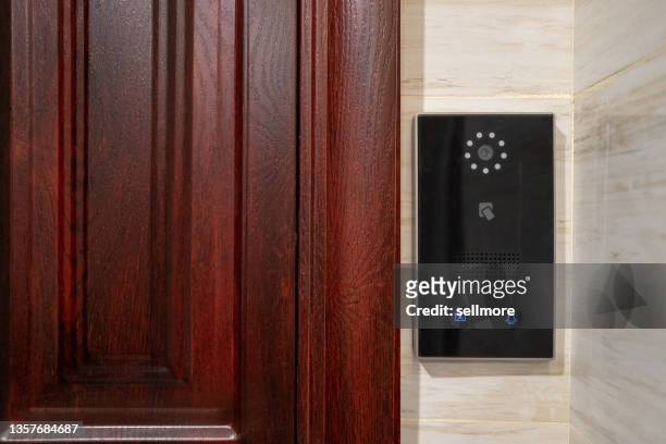 smart door lock at the door of the room - doorbell stock pictures, royalty-free photos & images