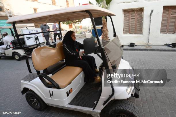 Woman drives a golf car during the Red Sea International Film Festival on December 07, 2021 in Jeddah, Saudi Arabia.