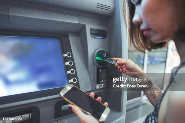 withdraw or deposit from cash machine - atm stock pictures, royalty-free photos & images