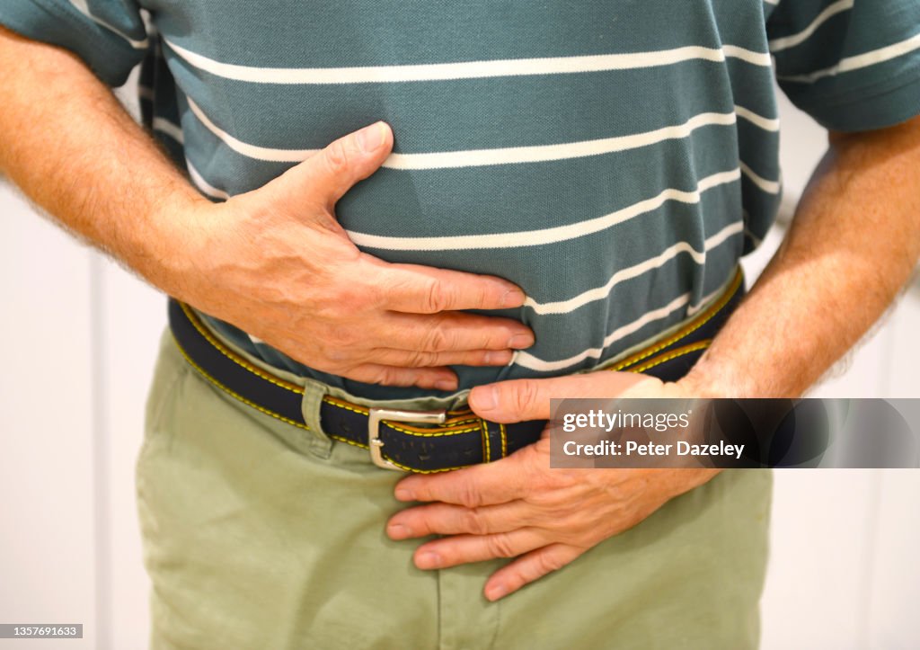 Senior man with stomach pain