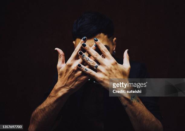 the tattooed hands. - nail polish stock pictures, royalty-free photos & images