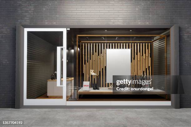 storefront of shoe store with poster mockup and shoes - shoe store front stock pictures, royalty-free photos & images