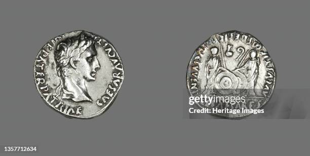 Denarius Portraying Emperor Augustus, 2 BCE-4 CE. Reverse: Caius and Lucius holding spears and shields, priestly instruments: a lituus and a simpulum...