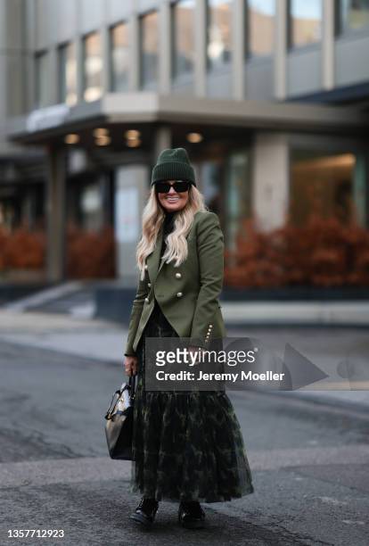Martina Maturi wearing Balmain olive blazer, Twinset olive skirt, Unio Hamburg green hat, Hermes leather vintage bag and Christian Dior black boots...