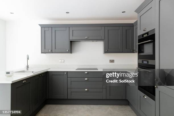 sleek and stylish - kitchen cabinets stock pictures, royalty-free photos & images