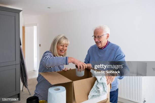 moving house is fun - unpacking stock pictures, royalty-free photos & images