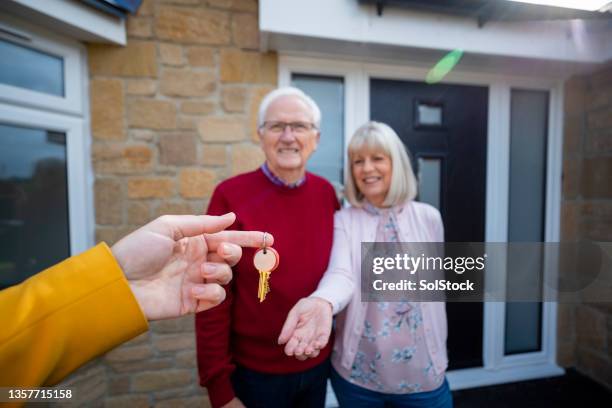 exchanging of keys - new home pov stock pictures, royalty-free photos & images