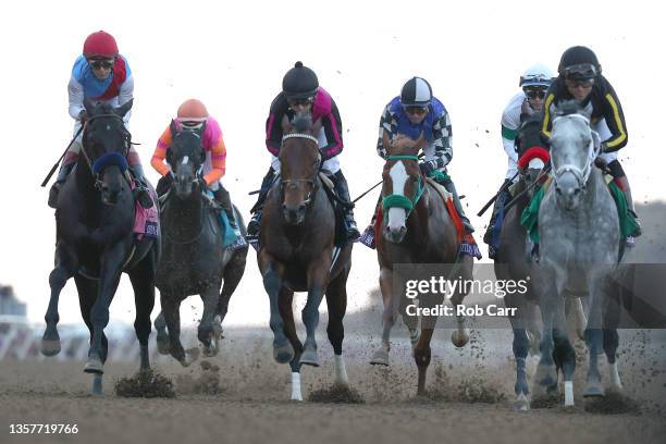 Jockey John Velazquez rides Medina Spirit, far left, into the first turn during the Breeders' Cup Classic at Del Mar Race Track on November 06, 2021...