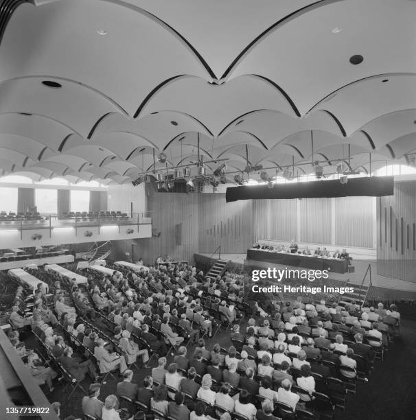 Laing's 1983 Annual General Meeting, . An elevated view of Laing's 1983 Annual General Meeting, showing rows of guests facing the stage during a...