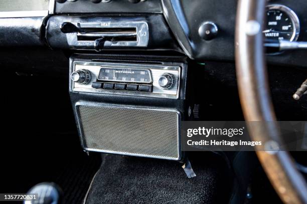 Radio in a 1961 Aston Martin DB4 GT SWB lightweight. Artist Unknown.