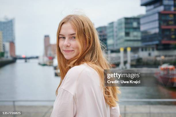 portrait of young woman - someone looking over shoulder stock pictures, royalty-free photos & images