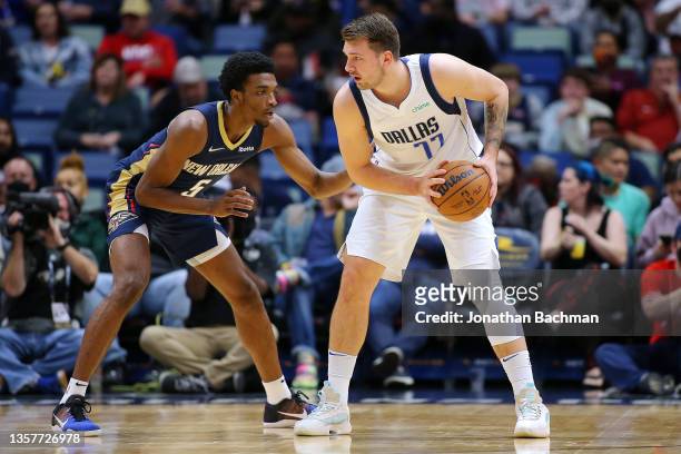 Luka Doncic of the Dallas Mavericks drives against Herbert Jones of the New Orleans Pelicans during the first half at Smoothie King Center on...